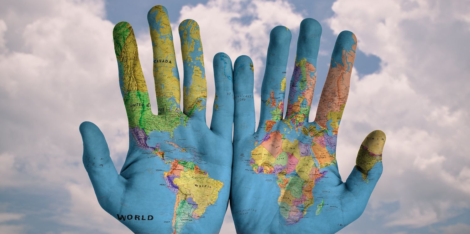 global-map-drawing-on-two-palms