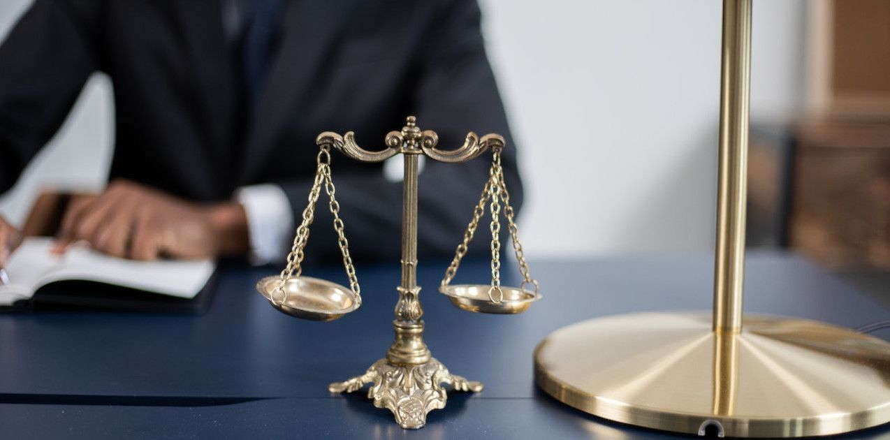scale-on-table-with-man-behind-it